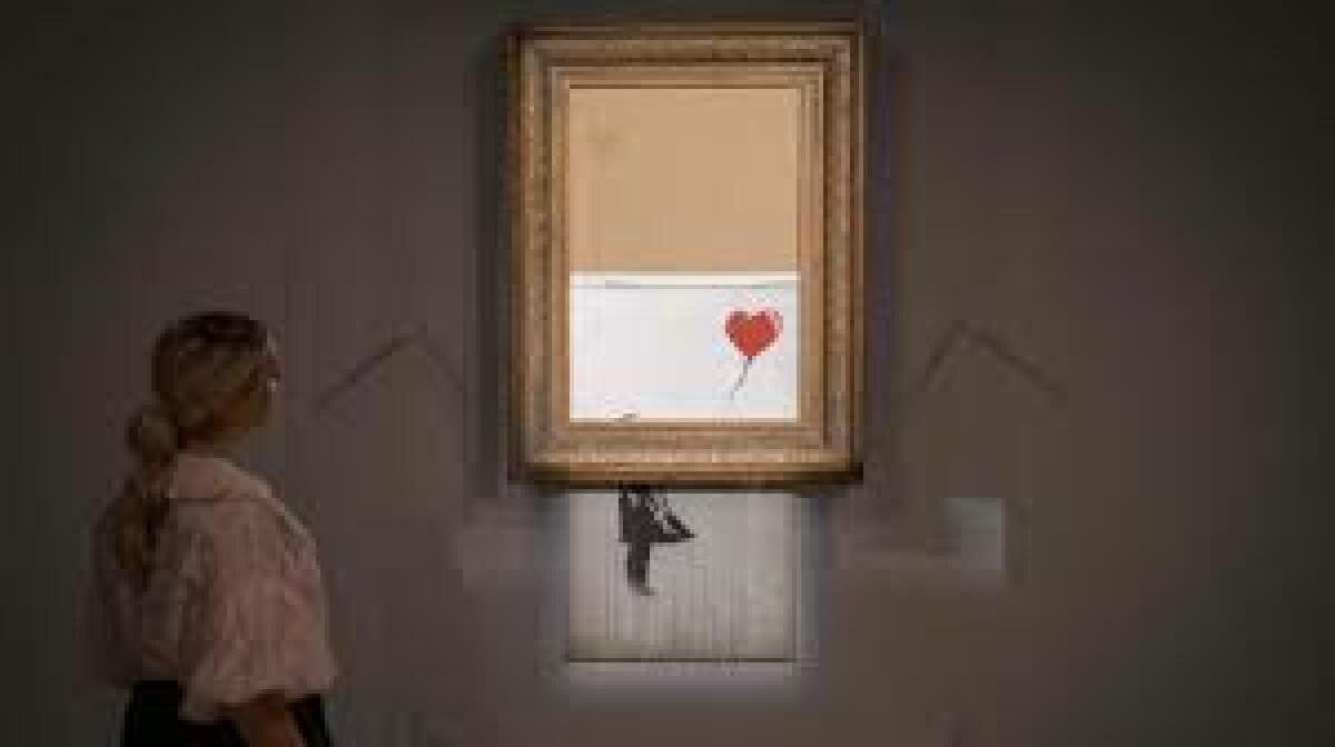 La obra de Banksy que se autodestruyó tras ser subastada se revende por 21 millones de euros